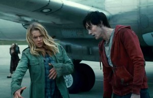 Julie and R the zombie from Warm Bodies prepare to shuffle through a crowd of the undead.